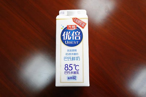 光明牛奶包装盒标注“85℃”被诉侵权 二审法院：属正当使用(图2)